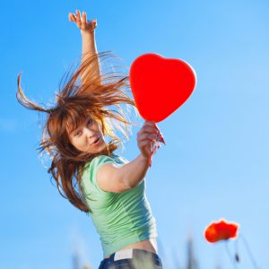 woman-jumping-with-heart